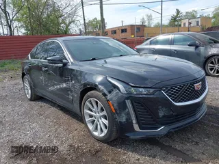 2021 Cadillac CT5 Luxury z VIN 1G6DX5RKXM0146235, wystawiony jako IAAI lot #42214676 z przebiegiem 72 847 mil mil oraz . Historia ofert i sprzedaży dostępna na DreamBid. Obrazek 1.