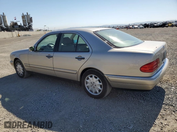 1999 Mercedes-Benz E-Class with VIN WDBJF65H5XA804902, listed as a Copart auction lot 73704634 with 92,411 mi miles and Salvage Title. Bid and sale history available at carsss.com. Image 2.