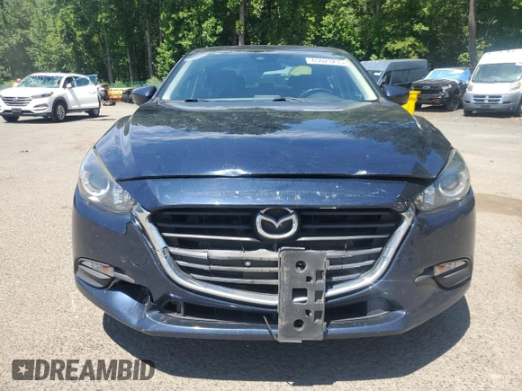 2017 Mazda 3 Touring with VIN JM1BN1V73H1125859, listed as a Copart auction lot 65023235 with 120,300 mi miles and Salvage title. Bid and sale history available at DreamBid. Image 5.
