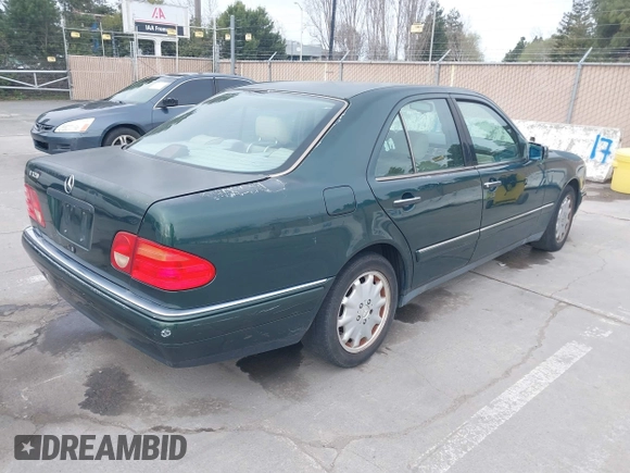 1997 Mercedes-Benz E-Class with VIN WDBJF55F3VJ034009, listed as a IAAI auction lot 41710225 with 239,673 mi miles. Bid and sale history available at carsss.com. Image 4.