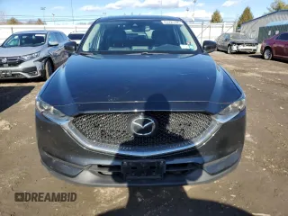 2019 Mazda CX-5 Grand Touring with VIN JM3KFBDM0K0571806, listed as a Copart auction lot 43395105 with 57,768 mi miles and Salvage Title. Bid and sale history available at carsss.com. Image 5.