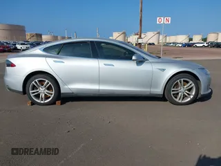 2013 Tesla Model S with VIN 5YJSA1AC3DFP10537, listed as a IAAI auction lot 40707549 with 103,111 mi miles and . Bid and sale history available at DreamBid. Image 14.