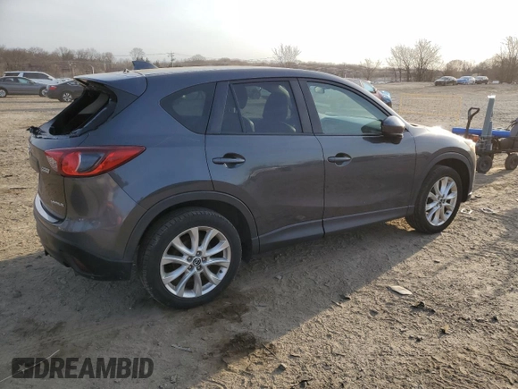 2014 Mazda CX-5 Grand Touring with VIN JM3KE4DY5E0372787, listed as a Copart auction lot 48873675 with 136,784 mi miles and Salvage Title. Bid and sale history available at carsss.com. Image 3.