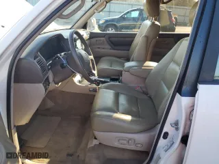 1999 Toyota Land Cruiser with VIN JT3HT05J8X0049750, listed as a Copart auction lot 77547144 with 168,435 mi miles and Salvage Title. Bid and sale history available at carsss.com. Image 7.