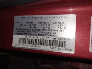 2015 Mazda 3 S Grand Touring with VIN JM1BM1M35F1233107, listed as a IAAI auction lot 41548503 with 141,496 mi miles and . Bid and sale history available at DreamBid. Image 9.