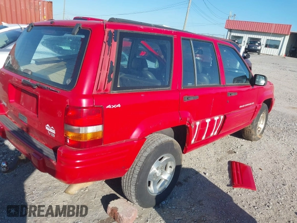 1998 Jeep Grand Cherokee Laredo with VIN 1J4GZ48Y6WC290798, listed as a IAAI auction lot 41816161 with 299,875 mi miles. Bid and sale history available at carsss.com. Image 4.