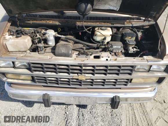 1995 Chevrolet Chevy Van z VIN 1GBEG25K9SF175004, wystawiony jako Copart lot #77952694 z przebiegiem 217 649 mil mil oraz Szkoda całkowita • Salvage title. Historia ofert i sprzedaży dostępna na DreamBid. Obrazek 12.