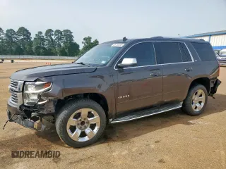 2015 Chevrolet Tahoe LTZ z VIN 1GNSCCKC8FR102859, wystawiony jako Copart lot #56755555 z przebiegiem 167 191 mil mil oraz Czysty tytuł • Clean title. Historia ofert i sprzedaży dostępna na DreamBid. Obrazek 1.