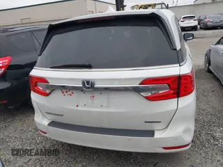 2020 Honda Odyssey Touring with VIN 5FNRL6H81LB028083, listed as a IAAI auction lot 42003810 with 71,536 mi miles and . Bid and sale history available at DreamBid. Image 16.