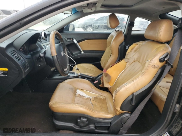 2006 Hyundai Tiburon GT with VIN KMHHN65FX6U224913, listed as a Copart auction lot 80695184 with 146,676 mi miles and Salvage Title. Bid and sale history available at carsss.com. Image 7.