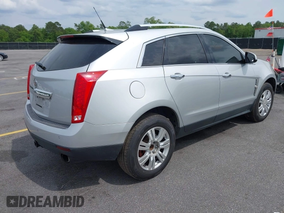 2011 Cadillac SRX Luxury Collection with VIN 3GYFNAEY5BS563048, listed as a IAAI auction lot 42031973 with 182,047 mi miles and . Bid and sale history available at DreamBid. Image 4.