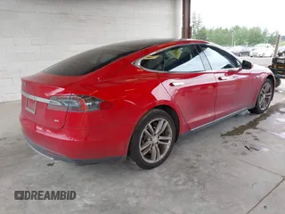 2013 Tesla Model S with VIN 5YJSA1CN7DFP26996, listed as a IAAI auction lot 42244540 with 128,160 mi miles and . Bid and sale history available at DreamBid. Image 4.