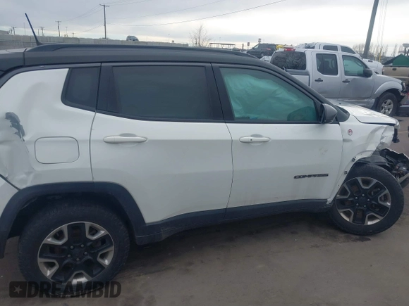 2018 Jeep Compass Trailhawk with VIN 3C4NJDDB9JT174899, listed as a IAAI auction lot 41635784 with 124,656 mi miles and . Bid and sale history available at DreamBid. Image 12.