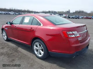 2014 Ford Taurus SEL with VIN 1FAHP2E85EG136900, listed as a IAAI auction lot 41941219 with 123,631 mi miles. Bid and sale history available at carsss.com. Image 3.