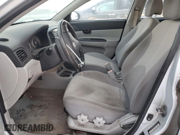 2007 Hyundai Accent GL z VIN KMHCN45CX7U127037, wystawiony jako Copart lot #86041984 z przebiegiem 212 828 mil mil oraz Szkoda całkowita • Salvage title. Historia ofert i sprzedaży dostępna na DreamBid. Obrazek 7.