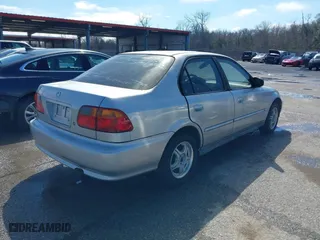 1999 Honda Civic VP with VIN 2HGEJ6615XH528453, listed as a IAAI auction lot 41655363 with 163,816 mi miles. Bid and sale history available at carsss.com. Image 4.