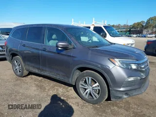 2017 Honda Pilot EX-L z VIN 5FNYF6H59HB101815, wystawiony jako IAAI lot #41704661 z przebiegiem 130 479 mil mil oraz . Historia ofert i sprzedaży dostępna na DreamBid. Obrazek 1.