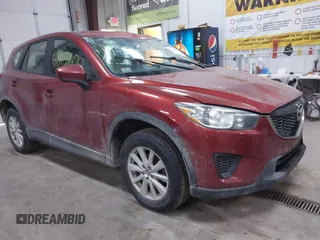 2013 Mazda CX-5 Sport z VIN JM3KE4BE7D0164630, wystawiony jako IAAI lot #41965600 z przebiegiem 157 879 mil mil oraz . Historia ofert i sprzedaży dostępna na DreamBid. Obrazek 1.