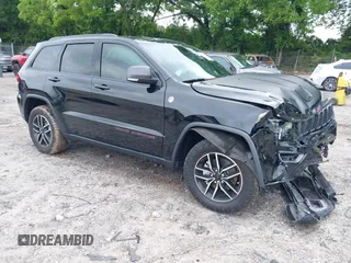 2020 Jeep Grand Cherokee Trailhawk with VIN 1C4RJFLG4LC387459, listed as a IAAI auction lot 42373820 with 55,492 mi miles and . Bid and sale history available at DreamBid. Image 1.