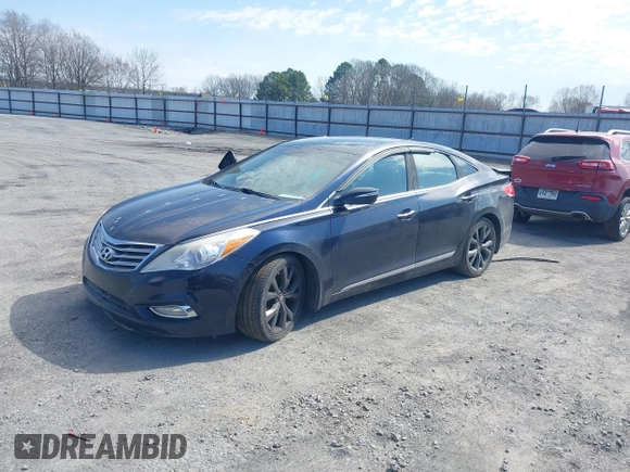 2013 Hyundai Azera with VIN KMHFH4JG6DA233205, listed as a IAAI auction lot 41643389 with 200,842 mi miles and . Bid and sale history available at carsss.com. Image 2.