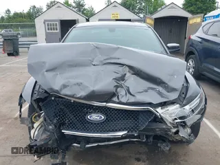 2015 Ford Taurus SEL with VIN 1FAHP2E81FG163058, listed as a IAAI auction lot 42221098 with 127,957 mi miles and . Bid and sale history available at carsss.com. Image 6.