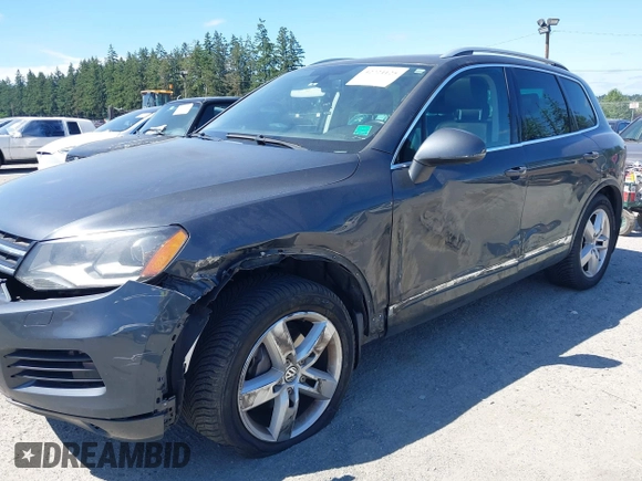 2012 Volkswagen Touareg Sport with VIN WVGFK9BP0CD004951, listed as a IAAI auction lot 42724125 with 173,993 mi miles and . Bid and sale history available at DreamBid. Image 6.