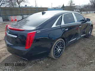 2015 Cadillac XTS Luxury z VIN 2G61N5S35F9155543, wystawiony jako IAAI lot #41699914 z przebiegiem 120 700 mil mil oraz . Historia ofert i sprzedaży dostępna na DreamBid. Obrazek 4.