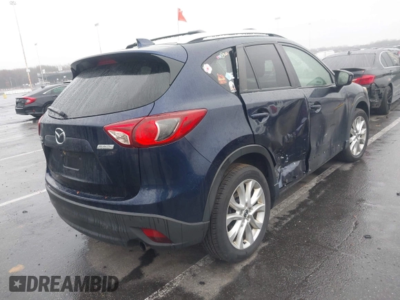 2014 Mazda CX-5 Grand Touring with VIN JM3KE4DY8E0366644, listed as a IAAI auction lot 41971438 with 135,644 mi miles and . Bid and sale history available at carsss.com. Image 4.
