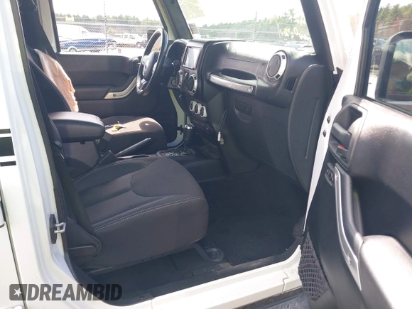 2015 Jeep Wrangler Unlimited Sahara with VIN 1C4HJWEG6FL556460, listed as a IAAI auction lot 42066648 with 54,747 mi miles. Bid and sale history available at carsss.com. Image 5.