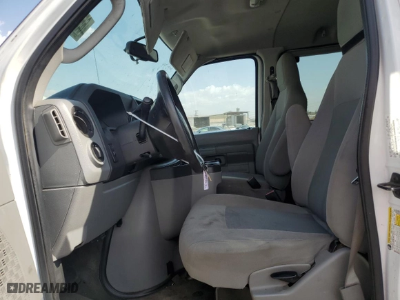 2014 Ford Econoline Wagon XL with VIN 1FBNE3BLXEDA14976, listed as a Copart auction lot 65948404 with 285,655 mi miles and Salvage Title. Bid and sale history available at carsss.com. Image 7.