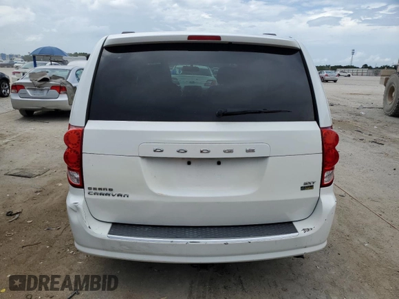 2014 Dodge Grand Caravan SXT z VIN 2C4RDGCG7ER214087, wystawiony jako Copart lot #61096815 z przebiegiem 131 241 mil mil oraz Czysty tytuł • Clean title. Historia ofert i sprzedaży dostępna na DreamBid. Obrazek 6.