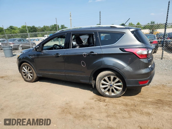 2018 Ford Escape Titanium with VIN 1FMCU9J90JUA15154, listed as a Copart auction lot 59768415 with 93,810 mi miles and Salvage title. Bid and sale history available at DreamBid. Image 2.