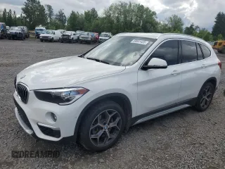 2018 BMW X1 xDrive28i with VIN WBXHT3C35J5L29298, listed as a Copart auction lot 59041435 with 27,612 mi miles and Salvage title. Bid and sale history available at DreamBid. Image 1.