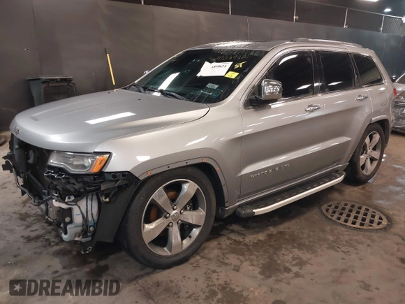 2015 Jeep Grand Cherokee Overland with VIN 1C4RJFCG1FC215426, listed as a IAAI auction lot 41689821 with 128,563 mi miles. Bid and sale history available at carsss.com. Image 18.