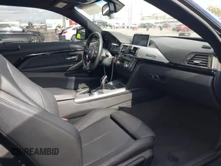 2014 BMW 4 Series 428i with VIN WBA3N7C55EF719504, listed as a IAAI auction lot 41403957 with 98,882 mi miles and . Bid and sale history available at carsss.com. Image 5.