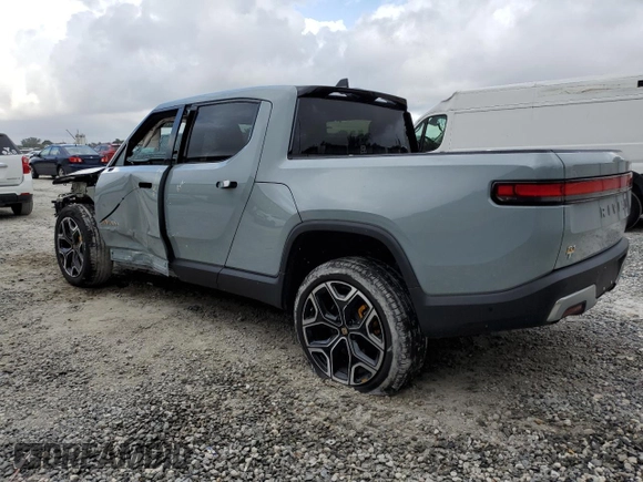 2022 Rivian R1T Launch Edition z VIN 7FCTGAALXNN004228, wystawiony jako Copart lot #43226985 z przebiegiem 4 mil mil oraz Szkody całkowita. Historia ofert i sprzedaży dostępna na DreamBid. Obrazek 2.