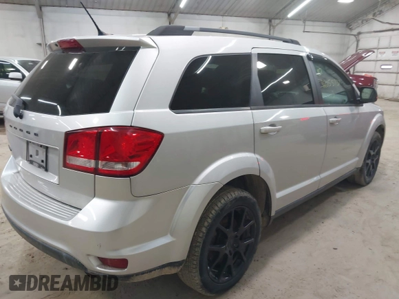 2013 Dodge Journey SXT with VIN 3C4PDCBBXDT661479, listed as a IAAI auction lot 42055731 with 151,963 mi miles. Bid and sale history available at carsss.com. Image 4.
