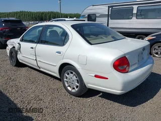 2000 Nissan Maxima GXE with VIN JN1CA31D7YT700656, listed as a IAAI auction lot 42675421 with 94,006 mi miles and . Bid and sale history available at DreamBid. Image 3.