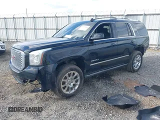 2015 GMC Yukon Denali with VIN 1GKS1CKJ8FR612971, listed as a IAAI auction lot 41519689 with 197,003 mi miles. Bid and sale history available at carsss.com. Image 17.