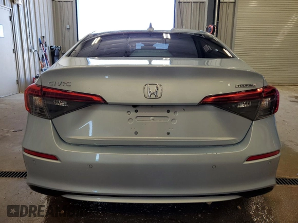 2022 Honda Civic Touring z VIN 2HGFE1F9XNH301080, wystawiony jako Copart lot #55320125 z przebiegiem 47 767 mil mil oraz Szkoda całkowita • Salvage title. Historia ofert i sprzedaży dostępna na DreamBid. Obrazek 6.