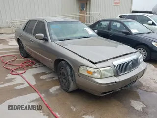 2006 Mercury Grand Marquis GS z VIN 2MEFM74VX6X655255, wystawiony jako IAAI lot #42261870 z przebiegiem Nie podano mil oraz . Historia ofert i sprzedaży dostępna na DreamBid. Obrazek 1.