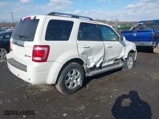 2009 Ford Escape Hybrid with VIN 1FMCU49319KC11629, listed as a IAAI auction lot 41426705 with 191,135 mi miles. Bid and sale history available at carsss.com. Image 4.