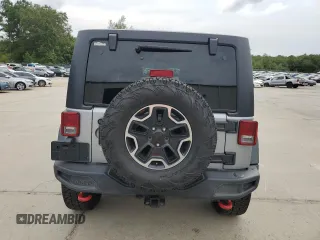 2013 Jeep Wrangler Unlimited Rubicon 10th Anniversary z VIN 1C4HJWFG3DL703331, wystawiony jako Copart lot #70823154 z przebiegiem 148 860 mil mil oraz Szkoda całkowita • Salvage title. Historia ofert i sprzedaży dostępna na DreamBid. Obrazek 6.