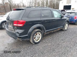 2013 Dodge Journey SXT with VIN 3C4PDDBG2DT507690, listed as a IAAI auction lot 41793988 with 211,110 mi miles and . Bid and sale history available at DreamBid. Image 4.