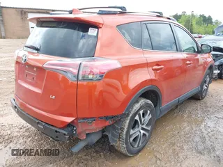 2016 Toyota RAV4 LE with VIN JTMZFREV9GJ074360, listed as a IAAI auction lot 42013611 with 87,578 mi miles. Bid and sale history available at carsss.com. Image 4.