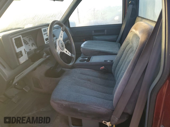1989 GMC Sierra 1500 with VIN 1GTDC14HXKZ548889, listed as a Copart auction lot 74876684 with 205,365 mi miles and Salvage Title. Bid and sale history available at DreamBid. Image 7.