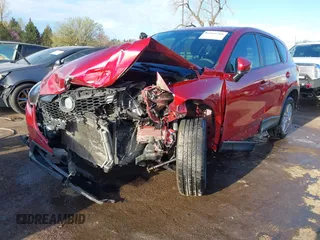 2015 Mazda CX-5 Sport z VIN JM3KE2BE7F0516869, wystawiony jako IAAI lot #41866488 z przebiegiem 131 237 mil mil oraz . Historia ofert i sprzedaży dostępna na DreamBid. Obrazek 18.