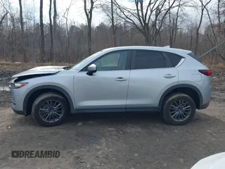2021 Mazda CX-5 Touring with VIN JM3KFBCM9M1329806, listed as a IAAI auction lot 41825123 with 59,300 mi miles. Bid and sale history available at carsss.com. Image 14.