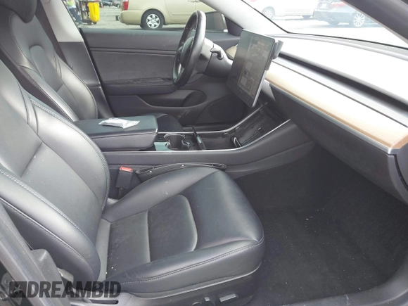 2019 Tesla Model 3 Mid Range with VIN 5YJ3E1EA3KF415601, listed as a IAAI auction lot 42125393 with 150,220 mi miles and . Bid and sale history available at carsss.com. Image 5.