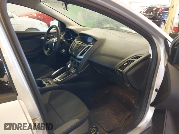 2013 Ford Focus SE z VIN 1FADP3F24DL277767, wystawiony jako IAAI lot #41562390 z przebiegiem 183 322 mil mil oraz . Historia ofert i sprzedaży dostępna na DreamBid. Obrazek 5.